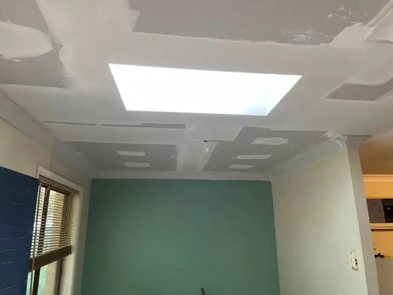 after shot of plastered water damaged ceiling