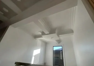 Decorative ceiling beams and cornice work in Kenmore finished with crisp trim detailing
