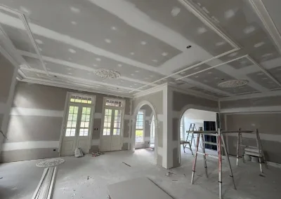 Decorative ceiling panels and ceiling roses in Hamilton with arched doorways jointed before final coat