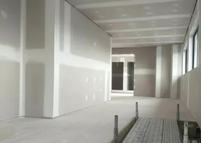 Drywall installation in Indooroopilly with a long corridor ceiling and walls jointed before painting