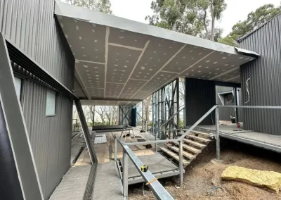 Exterior ceiling plasterboard installation in Brookfield with a cantilevered patio roof jointed before cladding
