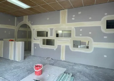 Plasterboard installation in Spring Hill with window and door frames taped and jointed around openings